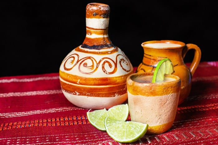 Pulque - traditional Mexican beverage in clay and pitcher