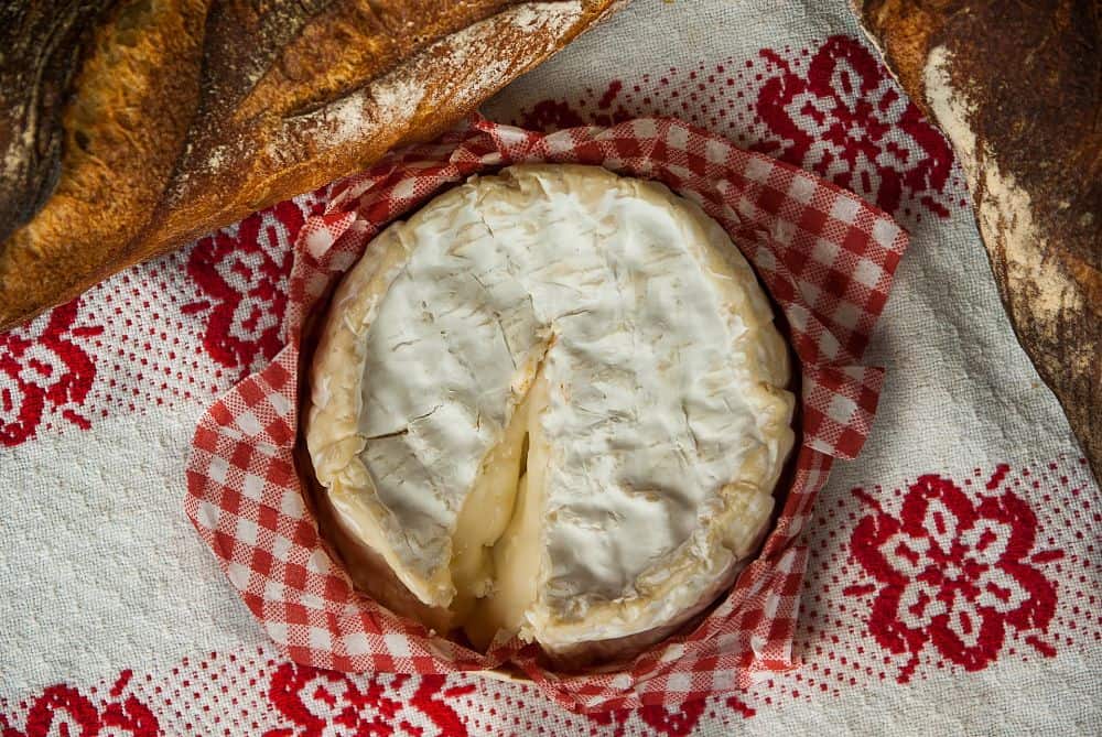 homemade soft cheese and freshly baked sourdough loaf