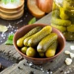 Marinated cucumbers gherkins. Pickles with mustard and garlic